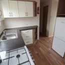 kitchen with fridge in the 2011 Atlas Chorus
