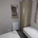 second view of twin bedroom