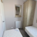 twin beds in the third bedroom in the 2021 Atlas Mirage 