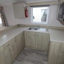 u shaped kitchen with cupboards in the 2021 Atlas Mirage 