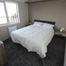 master double bedroom in the 2018 Atlas Lilac Lodge