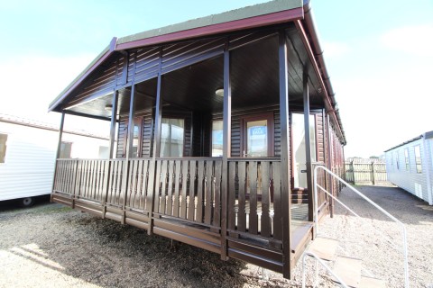 exterior of the large Tingdene Lodge for sale off site second hand